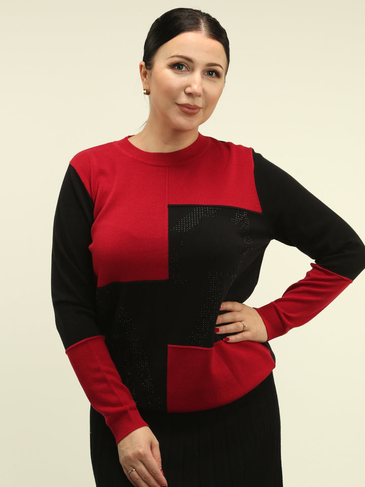Woman wearing a black and red color block sweater